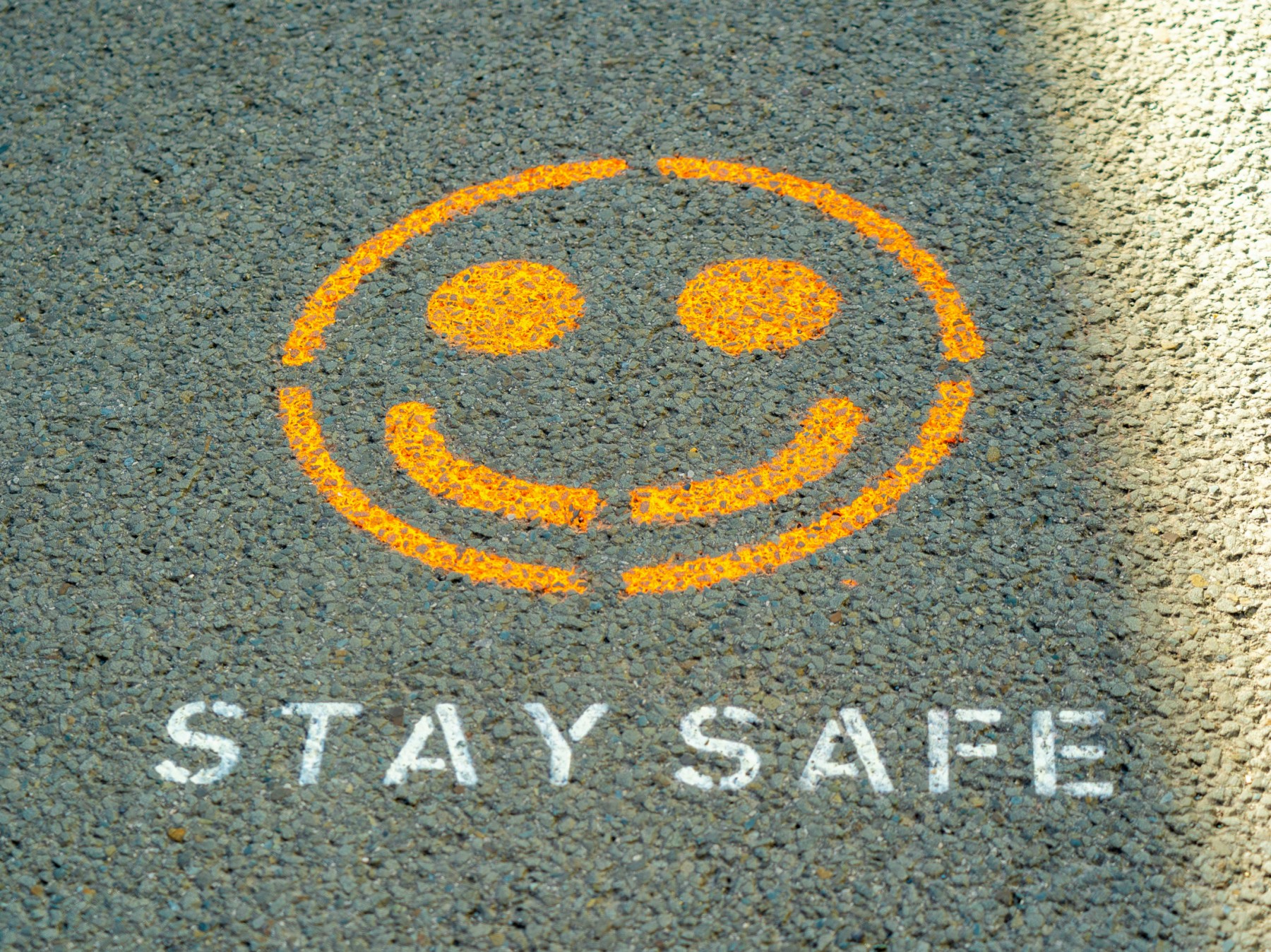 Stay safe written on the floor as Anthropic has detailed its safety strategy to try and keep its popular AI model, Claude, helpful while avoiding perpetuating harms.